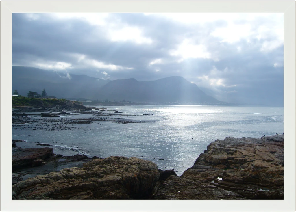 Top view of a Lapzadazy Lap Tray with a picture of Hermanus Rocks and Ocean